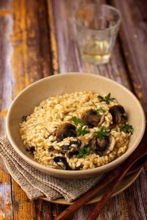 Mushroom risotto with a glass of wineの写真素材