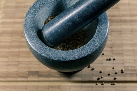 mortar and pestle with seedsの写真素材