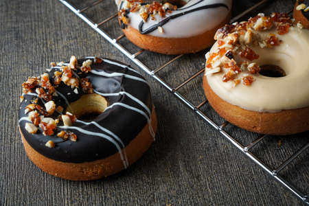 Homemade Gluten Free Donuts with Dark and White Chocolate Glaze Nougat Peanutの写真素材