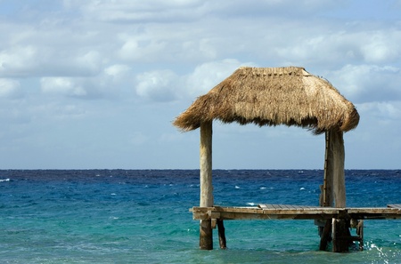 Tropical hut in oceanの写真素材