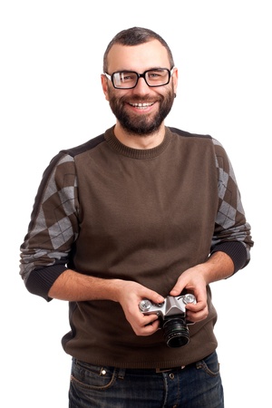 Young man with beard holding photo cameraの写真素材