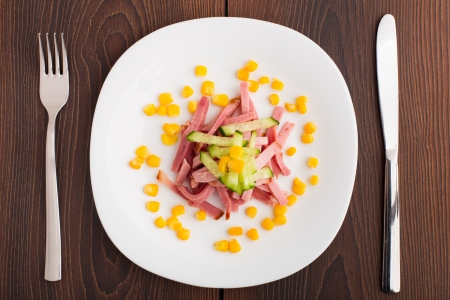 Chopped ham on white plateの写真素材