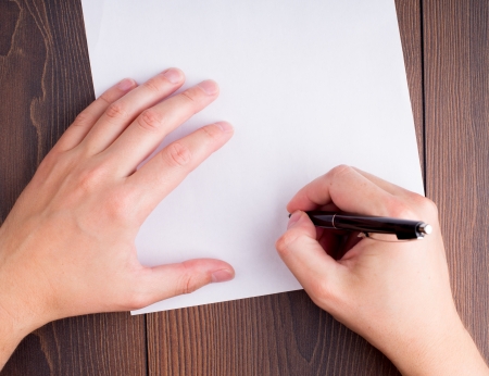 Top view of someone hands signing contractの写真素材