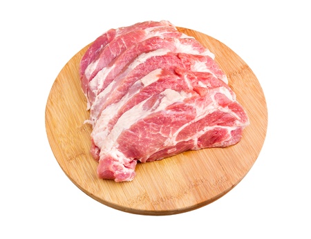 Fresh raw meat on a chopping boardの写真素材