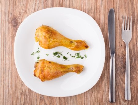 Fried chicken legs on white plateの写真素材