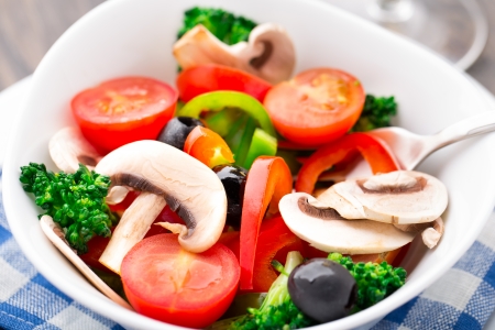 Vegetable salad with paprika, tomato, broccoli, champignon and oliveの写真素材