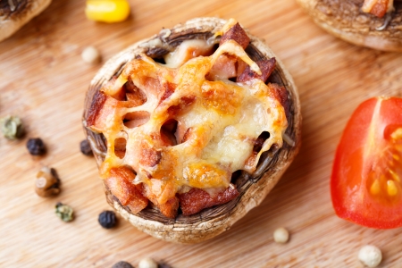 Delicious stuffed champignons with ham and cheeseの写真素材