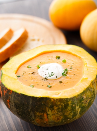 Delicious pumpkin soup in an open pumpkinの写真素材