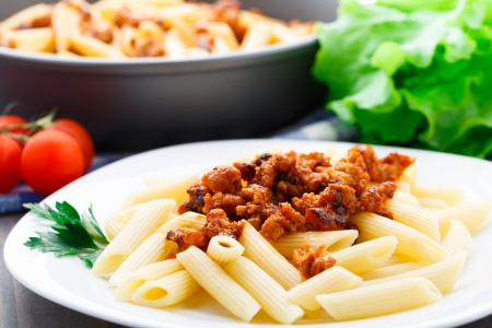 Delicious pasta with bolognese sauce on a plateの写真素材
