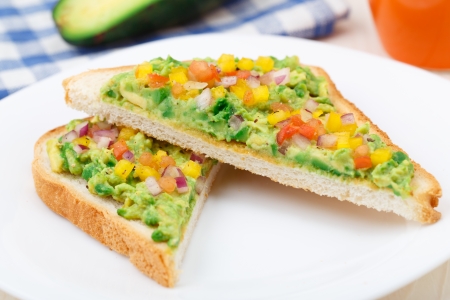 Delicious vegetarian sandwich with avocado and vegetables