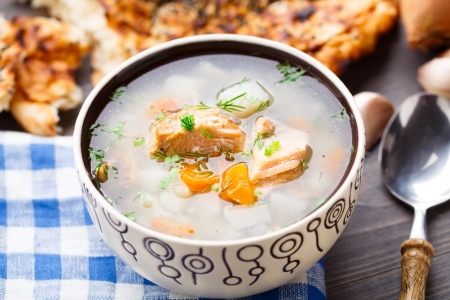 Fish soup with potato and rice in a bowlの写真素材