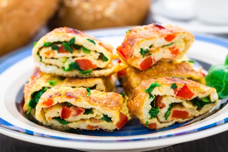 Omelet with vegetables and herbs on a plate