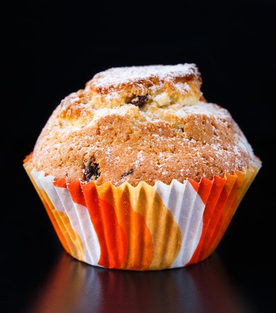 Sweet muffin with raisin on a tableの写真素材