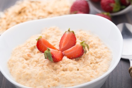 Healthy homemade oatmeal with strawberries for breakfastの写真素材