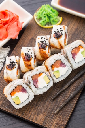 Sushi roll with salmon, tuna and eelの写真素材