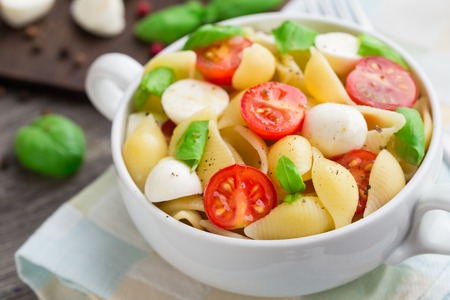 Pasta with mozzarella and tomatoの写真素材
