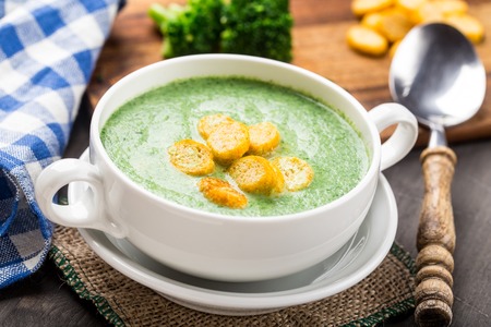 Broccoli cream soup on tableの写真素材
