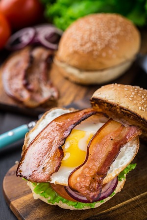 Home made burger on wooden boardの写真素材