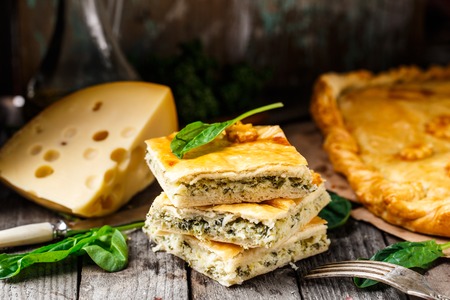 Homemade pie stuffed with cheese and spinachの写真素材