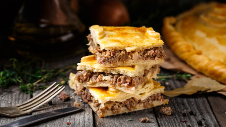 Delicious homemade pie stuffed with beef and herbs