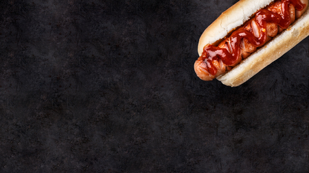 Barbecue grilled hot dog on a black backgroundの写真素材
