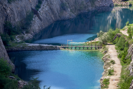Blue lagoon at the bottom of canyonの写真素材