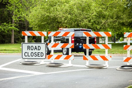 CLosed road with police carの写真素材