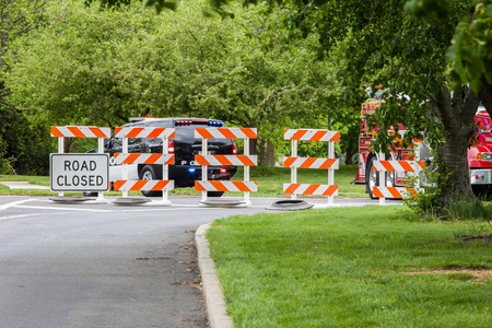 Closed road with police carの写真素材