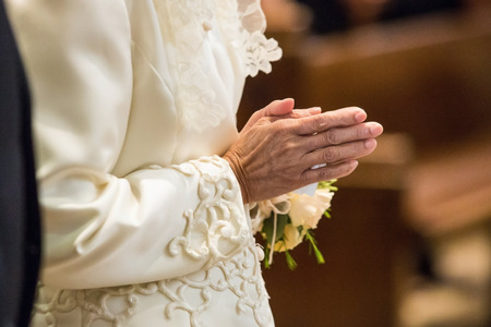 Old woman Praying at the churchの写真素材