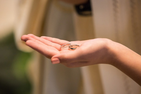 Bride and groom rings at the ceremonyの写真素材