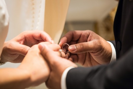 Bride and groom rings at the ceremonyの写真素材