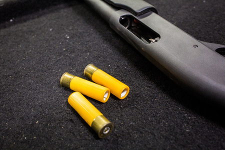 Shotgun and ammo at the rangeの写真素材