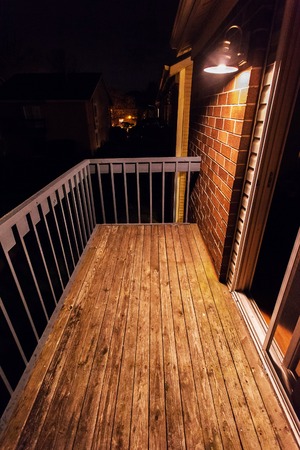Empty balcony with a lamp at night wooden