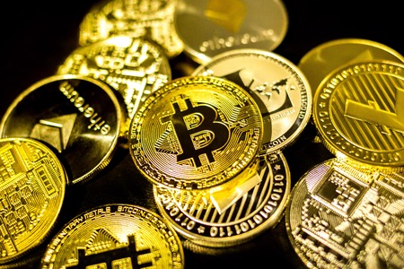 Bitcoin, litecoin, etherium coins close up dark theme