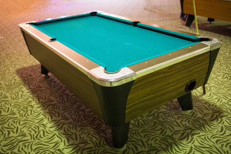 Regular pool table empty with a pool stick greenの写真素材