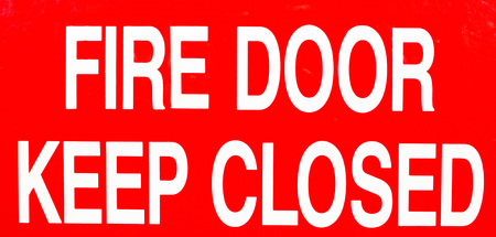 Fire door keep closed sign for the exit doorの写真素材
