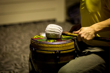 Drummer Performing on african drum close upの写真素材