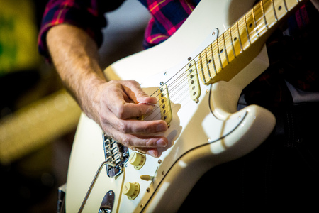 Artist playing electric guitar on the stage soloの写真素材