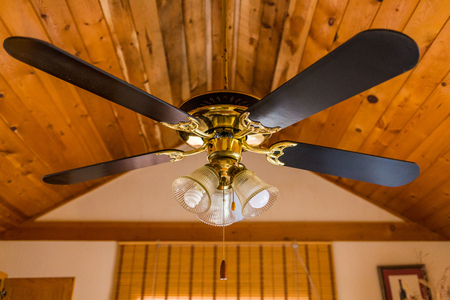 Vintage ceiling wooden fan with lamp propellerの写真素材