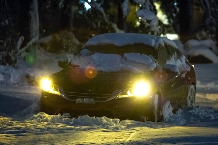 Car under heavy snow after snow storm winter hurricaneの写真素材