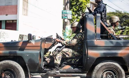 Kingston, Jamaica - 11/27/2013: Soldiers in the city on duty in the car