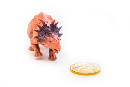 Dinosaurs meet bitcoin concept isolatedの写真素材
