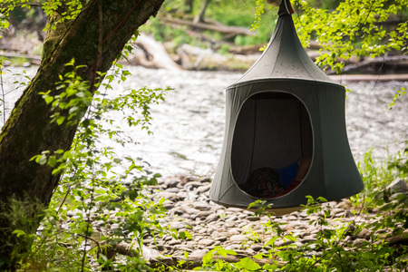 Cacoon hanging tent outside peaceful relaxationの写真素材