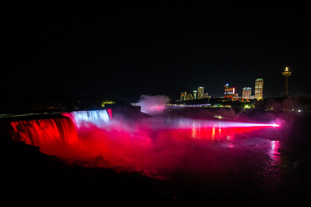 NIagara falls illuminated with color lights at nightの写真素材