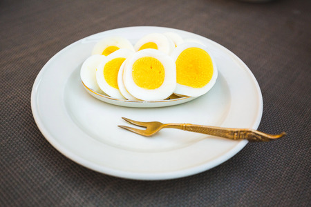 Healthy breakfast with sliced eggs on a plateの写真素材