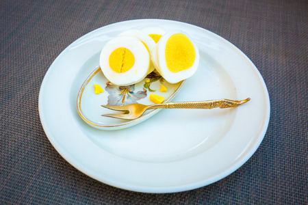 Healthy breakfast with sliced eggs on a plateの写真素材