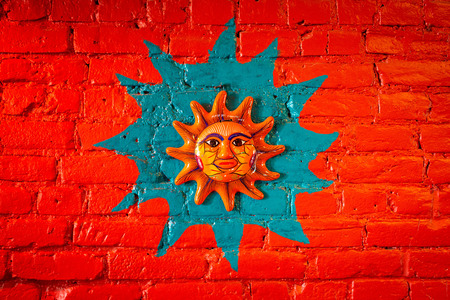 Sun decoration on brick wall latin cultureの写真素材
