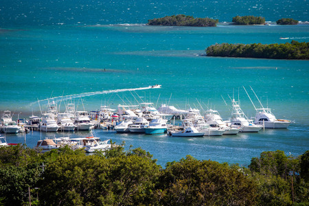 Multiple boats docked at bay of Puerto Rico at dayの写真素材