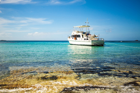 Private boat at seashore carribean vacation getaway nobodyの写真素材