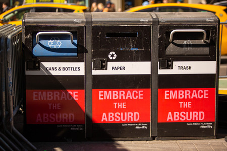 Recycling trash bins containers on the street of Manhattan at dayの写真素材